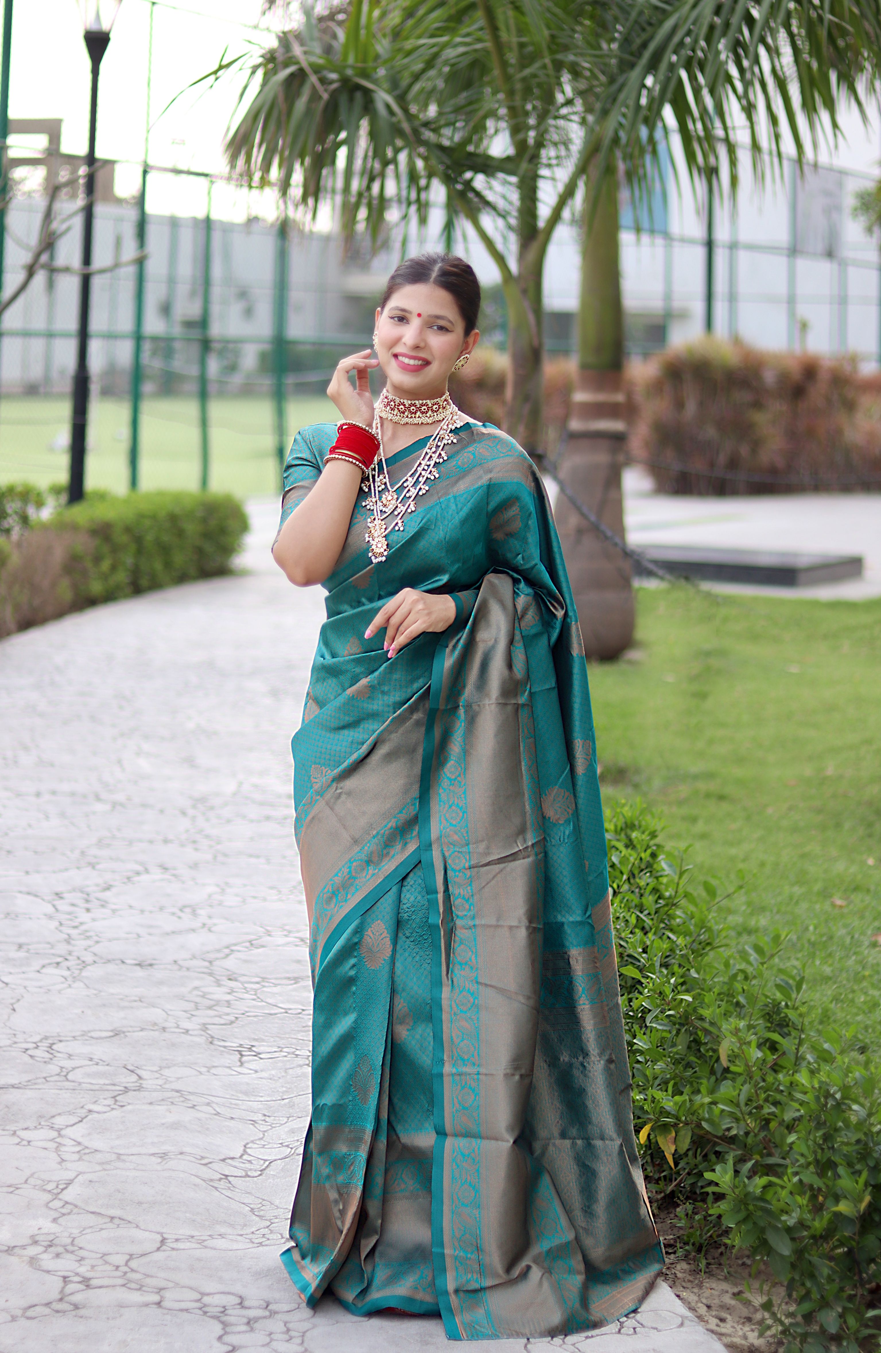 Striking Rama Banarasi Silk Saree With Bewitching Blouse Piece