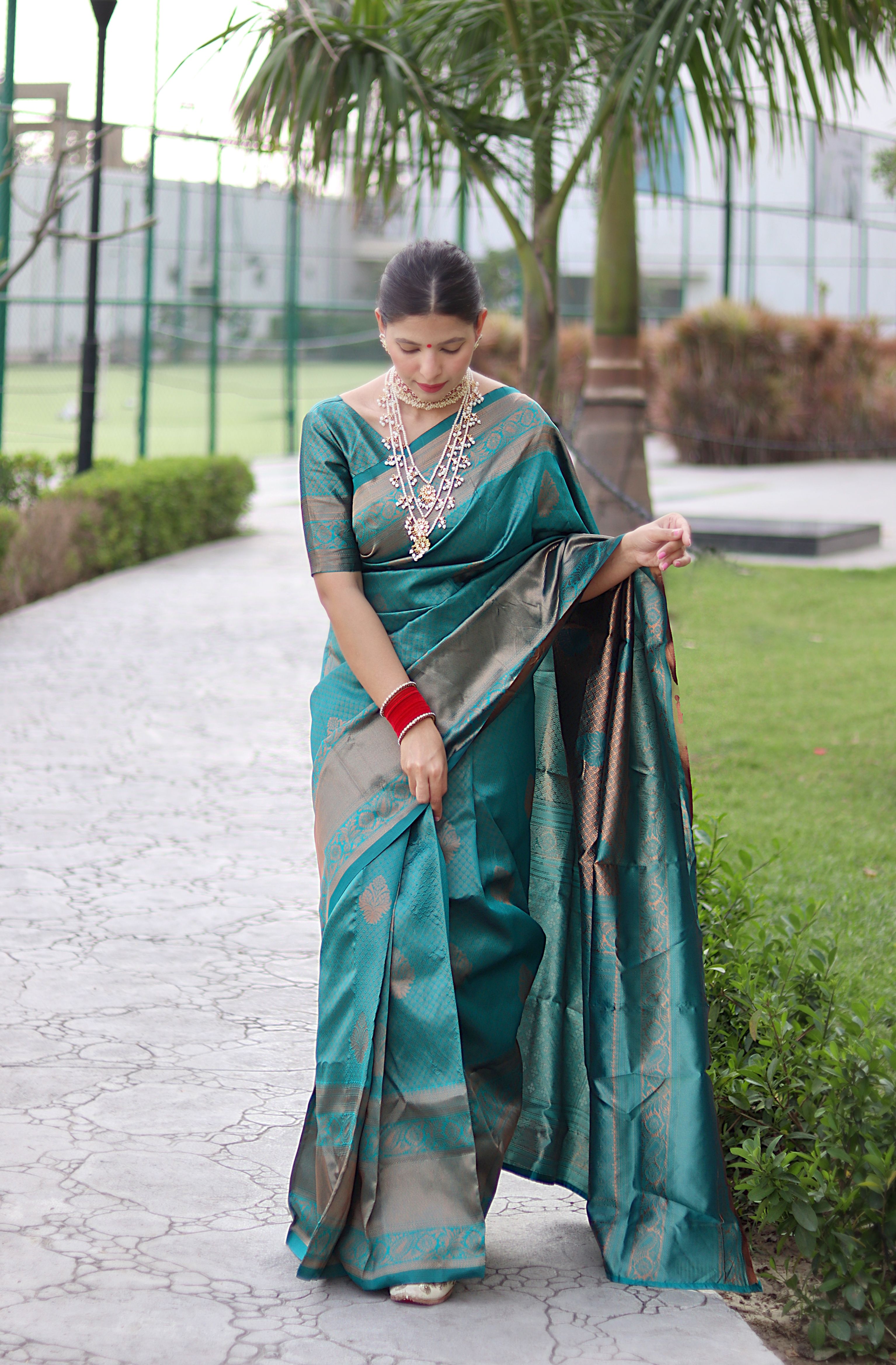 Striking Rama Banarasi Silk Saree With Bewitching Blouse Piece