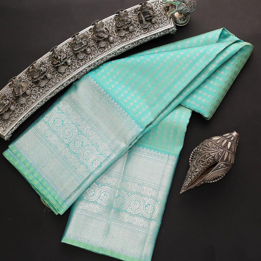 Attractive Firozi Soft Silk Saree With Outstanding Blouse Piece