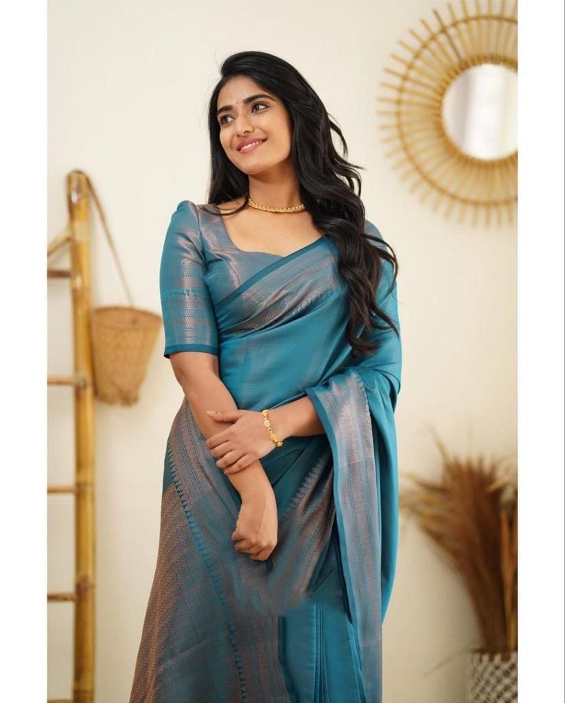 Surreptitious Firozi Soft Silk Saree With Exuberant Blouse Piece