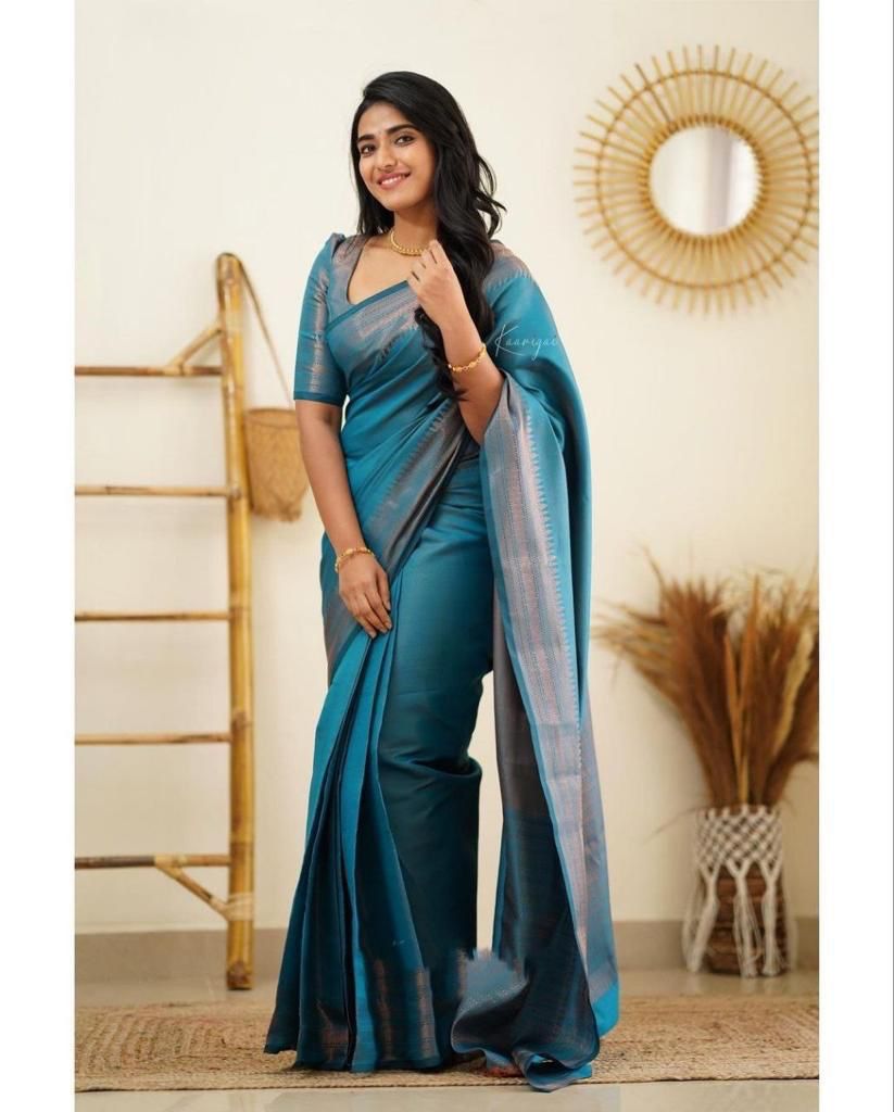 Surreptitious Firozi Soft Silk Saree With Exuberant Blouse Piece
